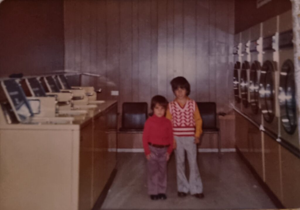 Anastasios and Alexandra's children posing in the original Laundromat in Northcote